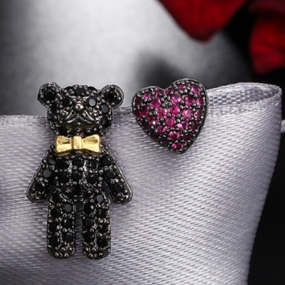 Asymmetrical Bear & heart crystal earrings…